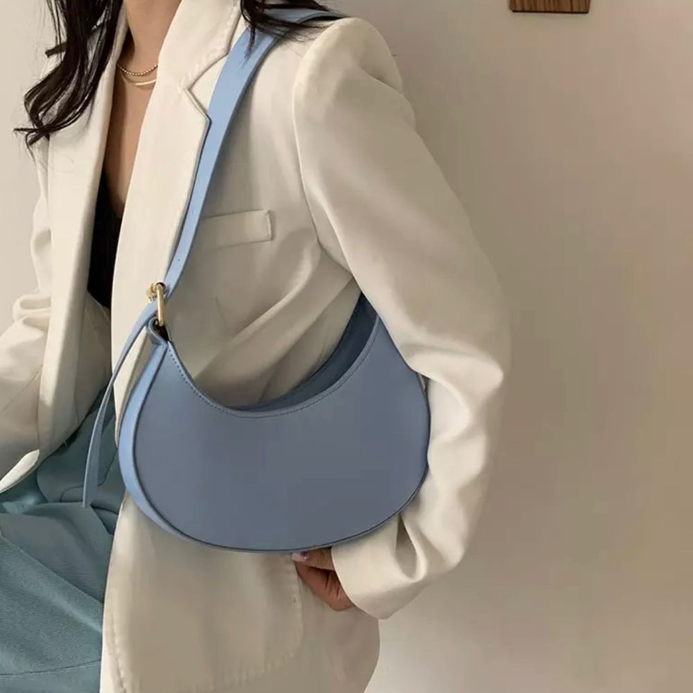 Half moon pastel blue shoulder bag